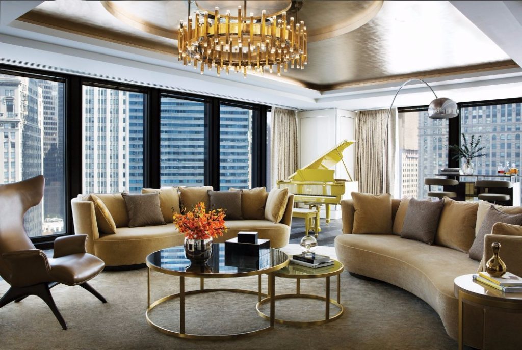 Glass and golden brass center table in living room hotel chicago