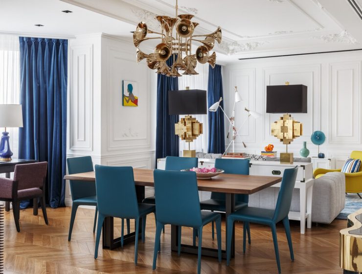 blue chairs golden chandelier dining room